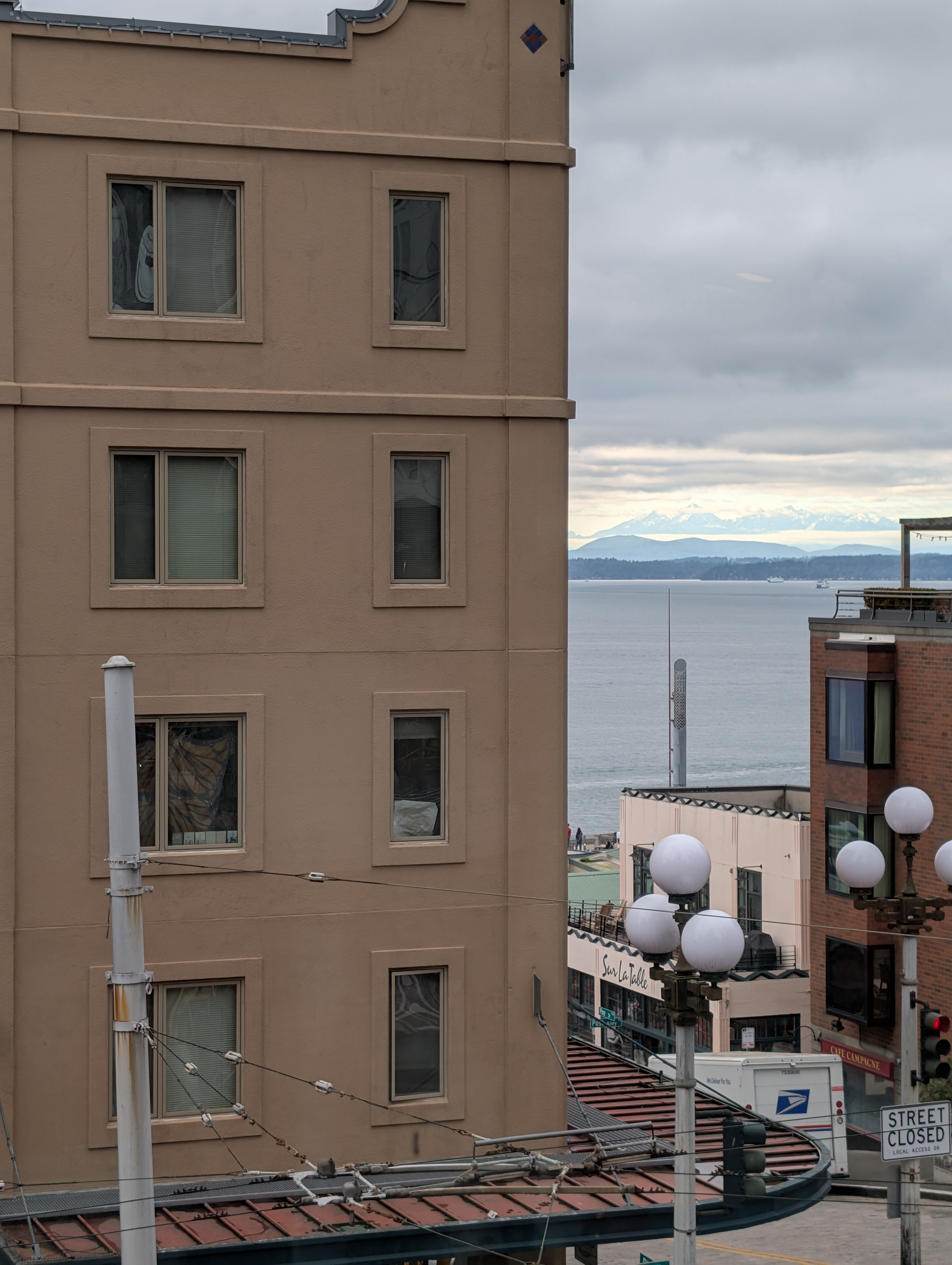 A pear set on a yellow plate upon a soft white canvas texture.