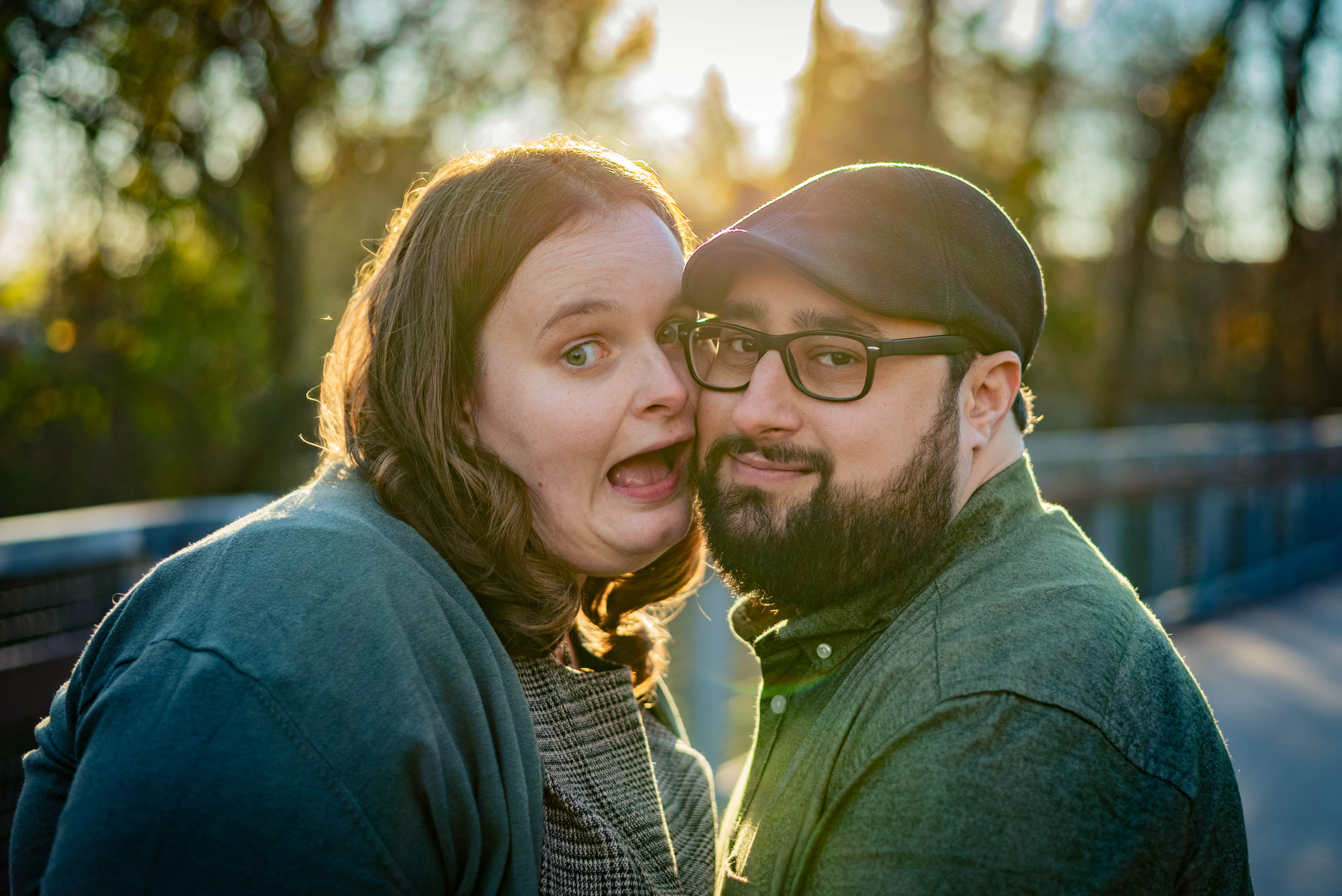 Polaroid photo of a couple posing together on a bed with the date 06/10/19 written on the polaroid.